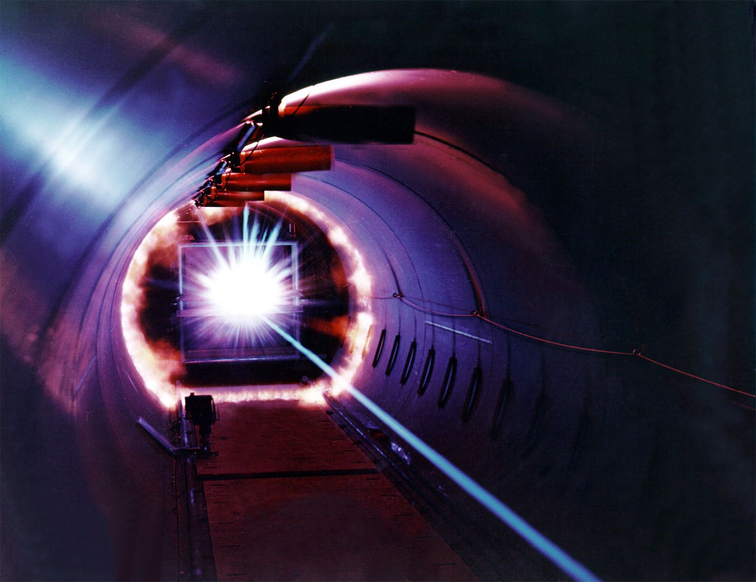 Bright energy flash as a hypervelocity projectile strikes a target