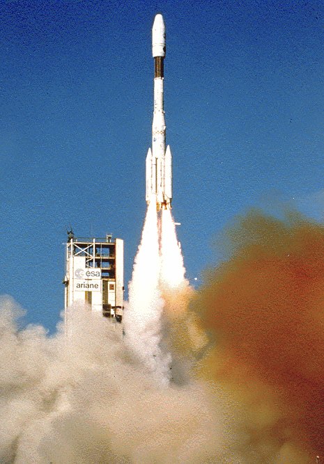 An Ariane 4 rocket climbing away from its launch pad at Kourou trailing a bright exhaust plume