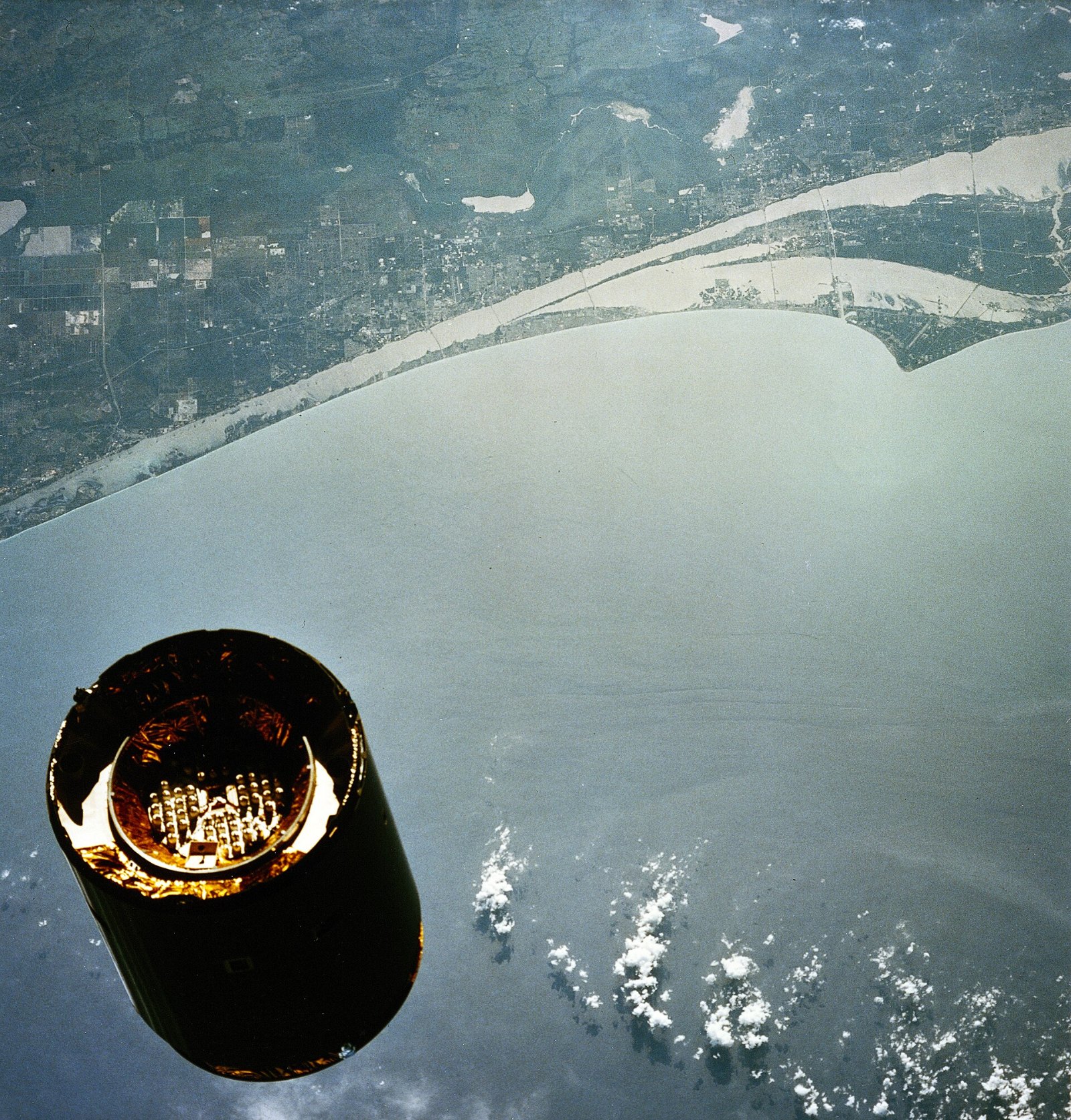 The stranded Intelsat VI satellite seen from Space Shuttle Endeavour with Florida below